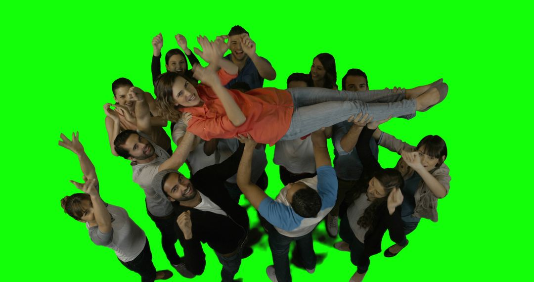 Group of Friends Holding Woman Up Against Green Screen - Free Images, Stock Photos and Pictures on Pikwizard.com