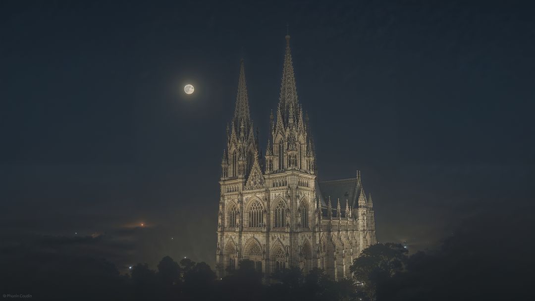 Gothic Cathedral Illuminated by Moonlight with Twin Spires