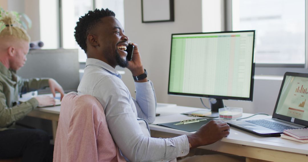 Business Professional Phone Call in Modern Workspace