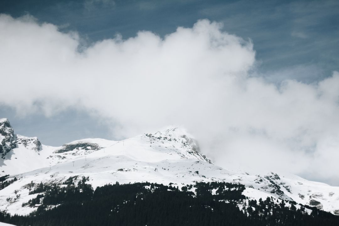 Snow-capped Mountain Peaks under Cloudy Sky - Free Images, Stock Photos and Pictures on Pikwizard.com