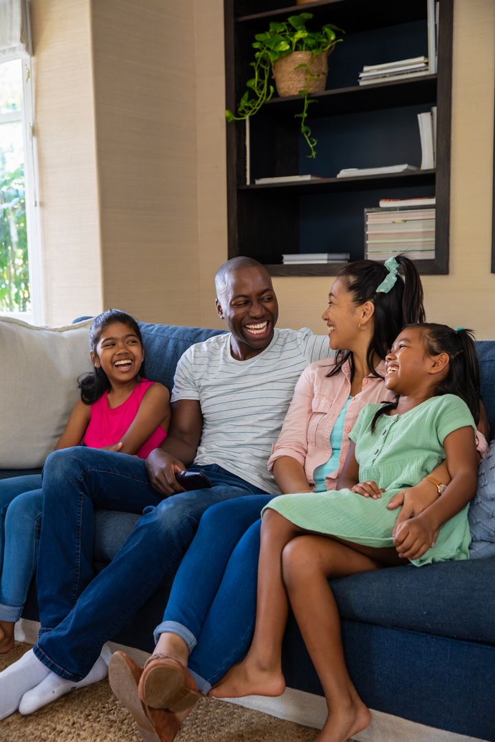 Diverse Family Enjoying Quality Time Together on Couch