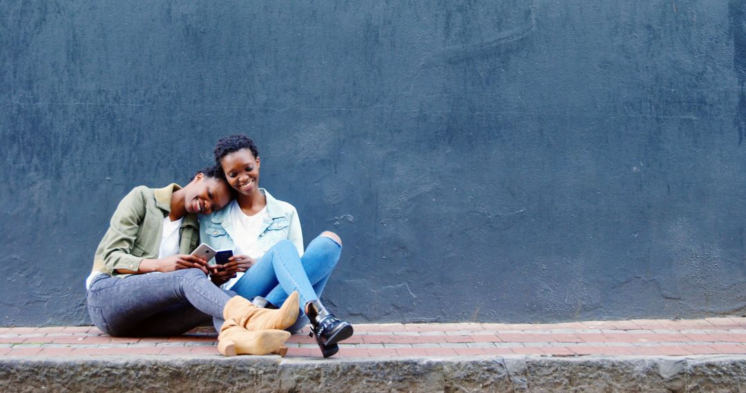 Twin Sisters Sharing Moment Exploring Digital Content