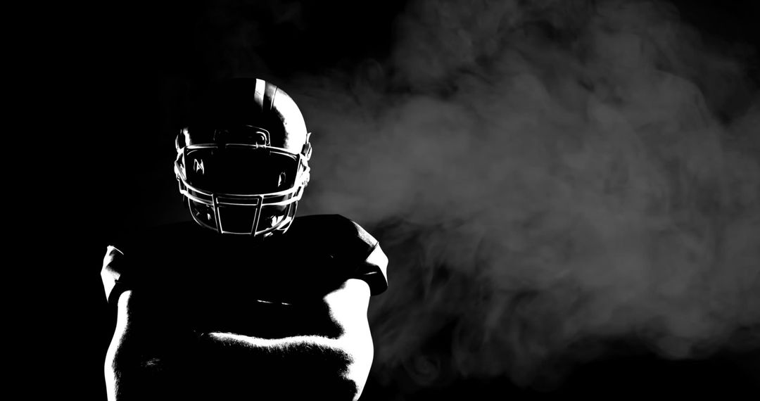 Silhouetted American Football Player in Dramatic Lighting - Free Images, Stock Photos and Pictures on Pikwizard.com