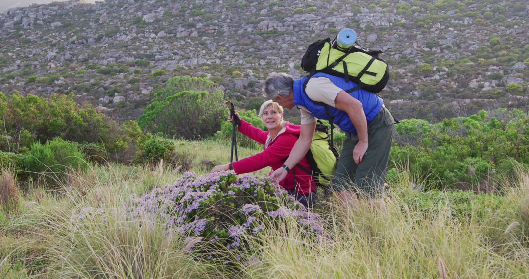 Senior couple enjoys trekking and exploring nature in the mountains. - Free Images, Stock Photos and Pictures on Pikwizard.com