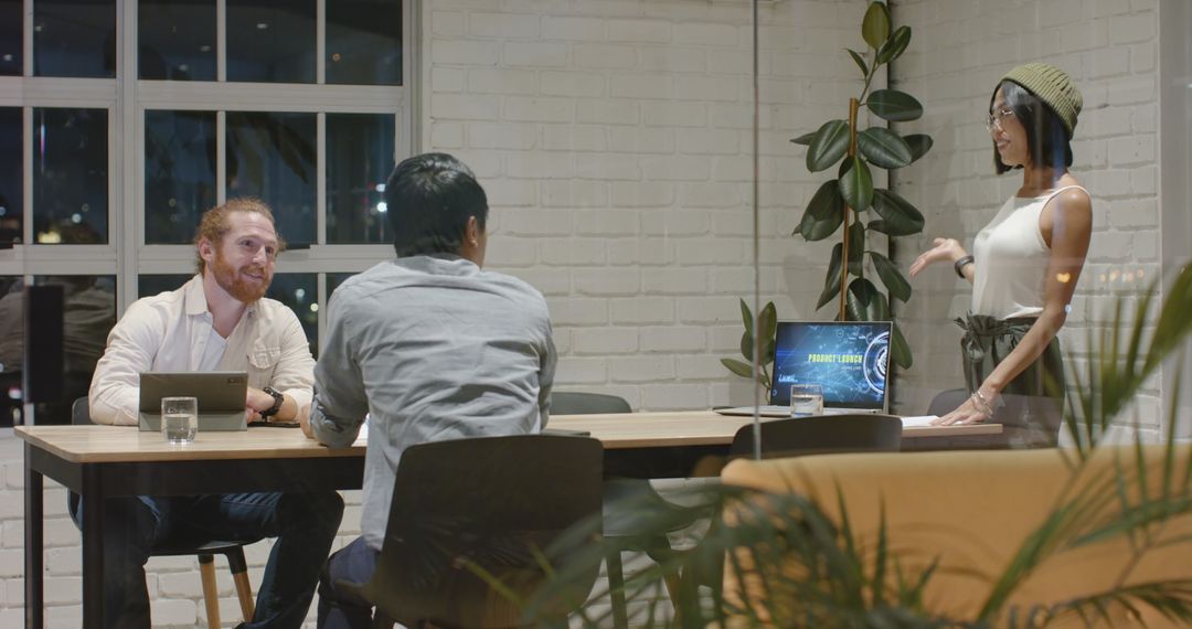 Diverse Team Collaborating in Night Office Meeting