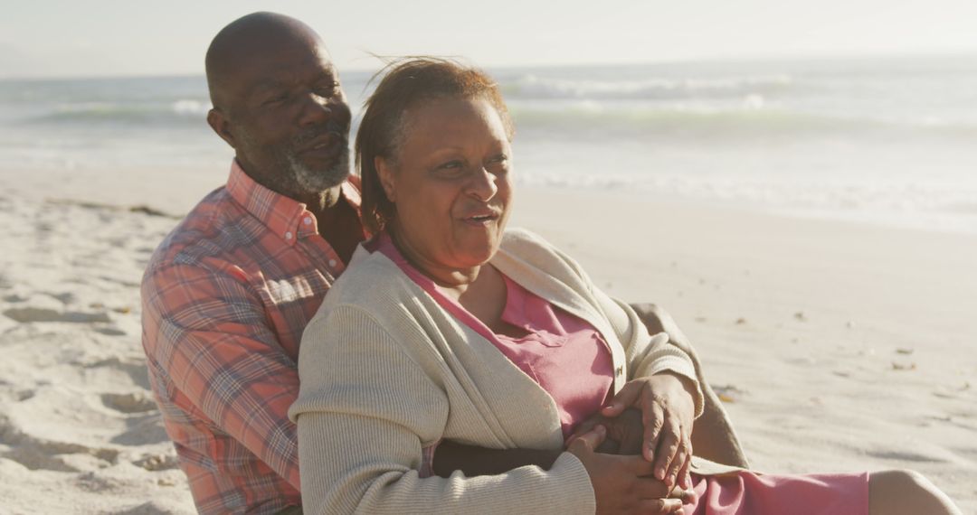 Senior Couple Embracing on Beach During Sunny Afternoon - Free Images, Stock Photos and Pictures on Pikwizard.com