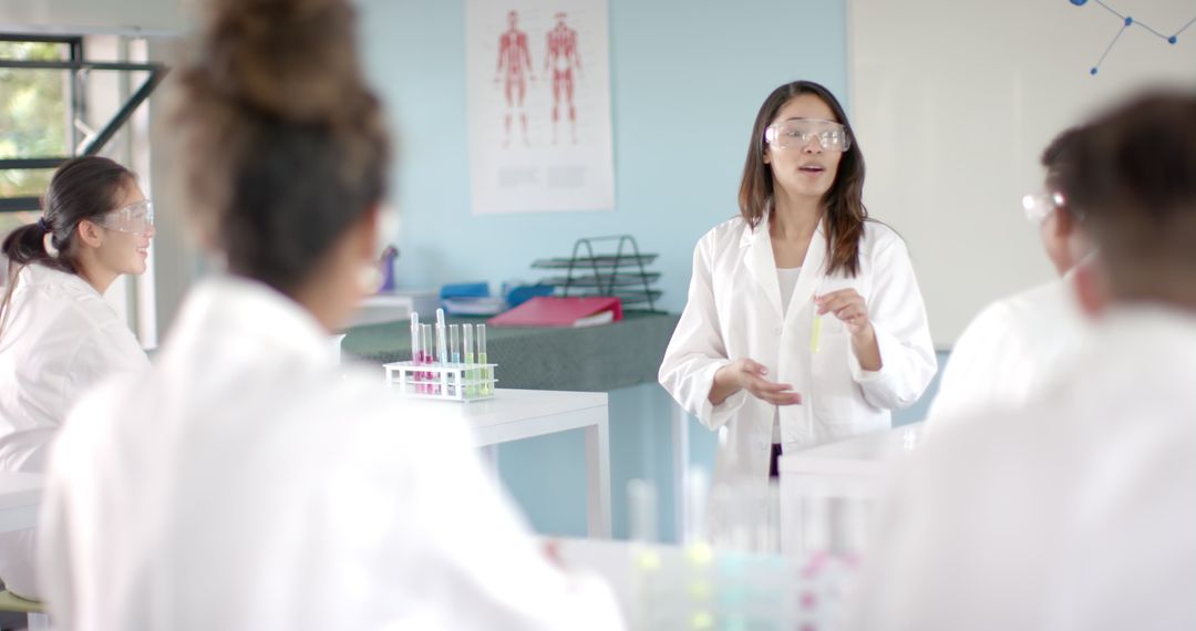 Diverse High School Students Engaging in Science Lab Experiment with Teacher
