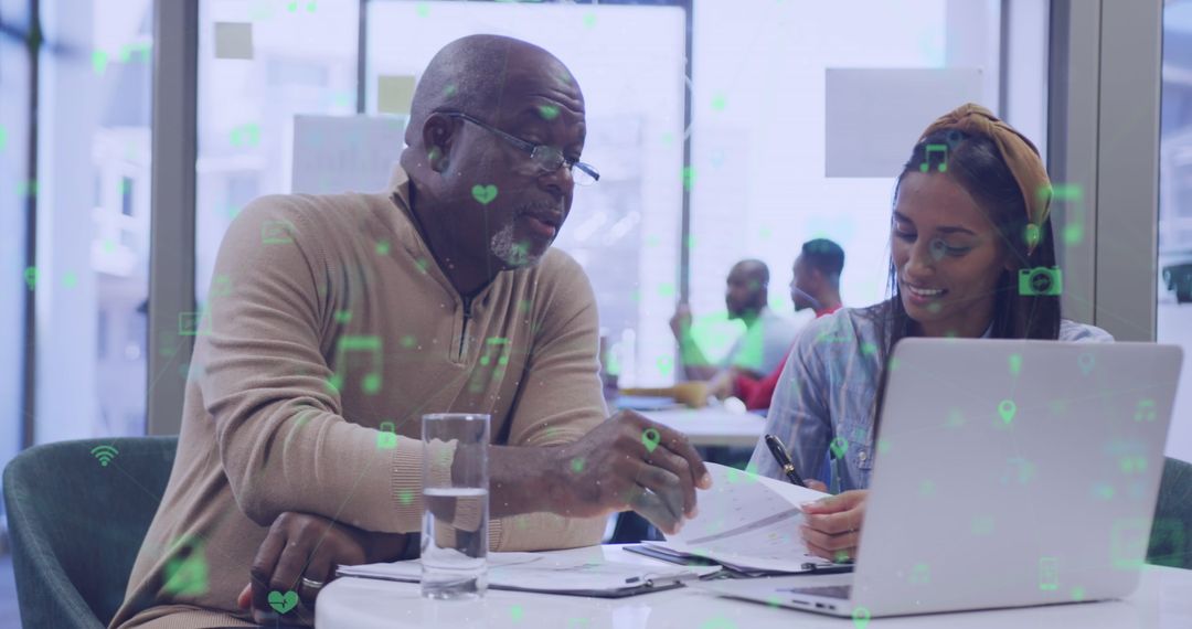 Diverse Professionals Engaging with Digital Interface in Modern Office