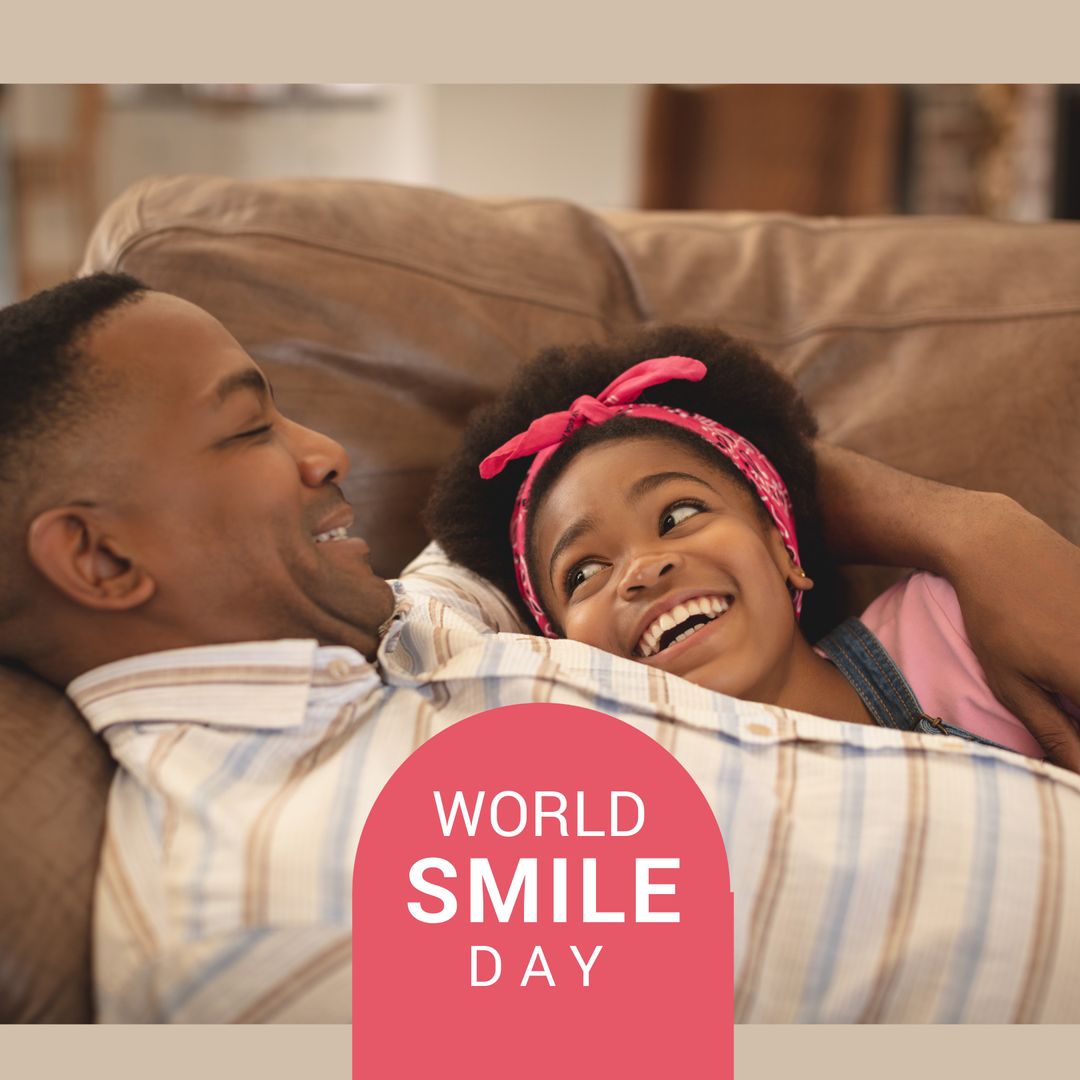 Father and Daughter Celebrating World Smile Day with Joyful Laughter