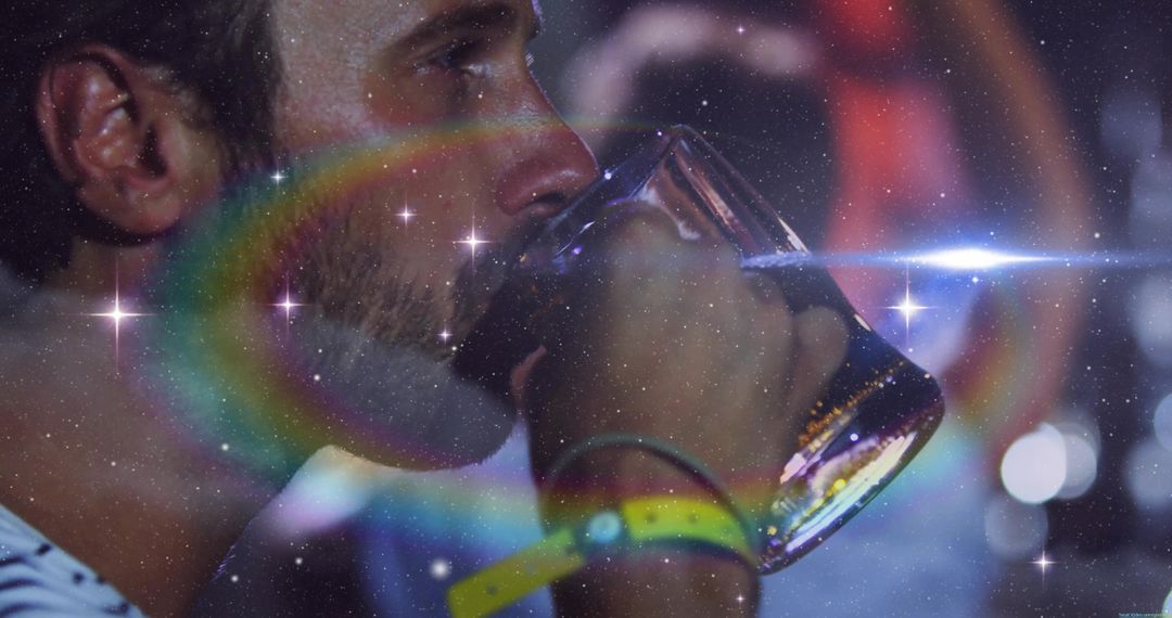 Man Enjoying Beer at Vibrant Pub with Radiant Lens Flares
