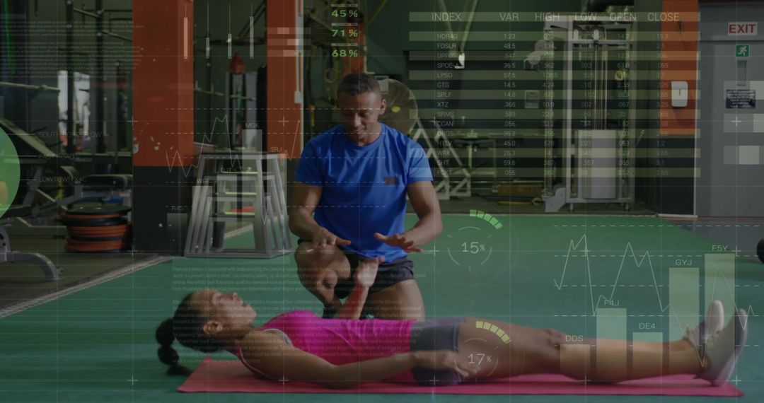 Personal Trainer Guiding Client During Workout Session at Gym