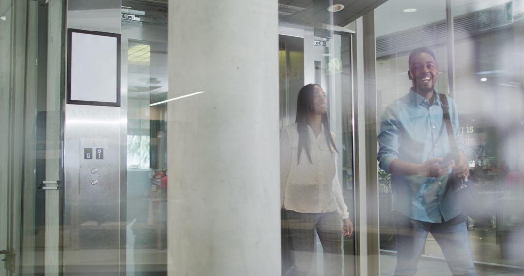 Happy Professionals Entering Modern Office Building - Free Images, Stock Photos and Pictures on Pikwizard.com