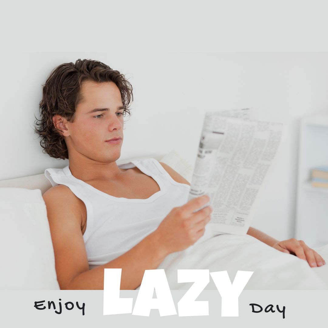 Young Man Relaxing with Newspaper in Bed on Lazy Day