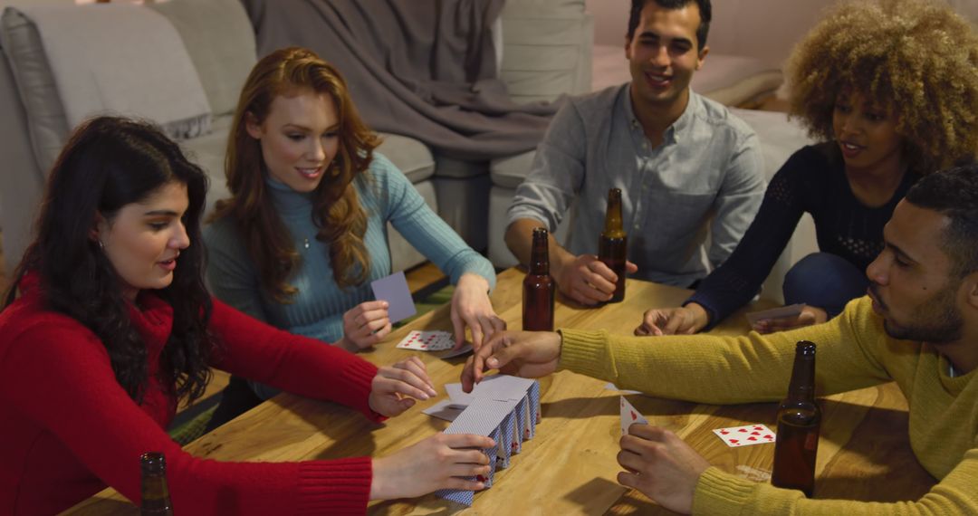 Diverse group of friends enjoy a game night at home from Pikwizard