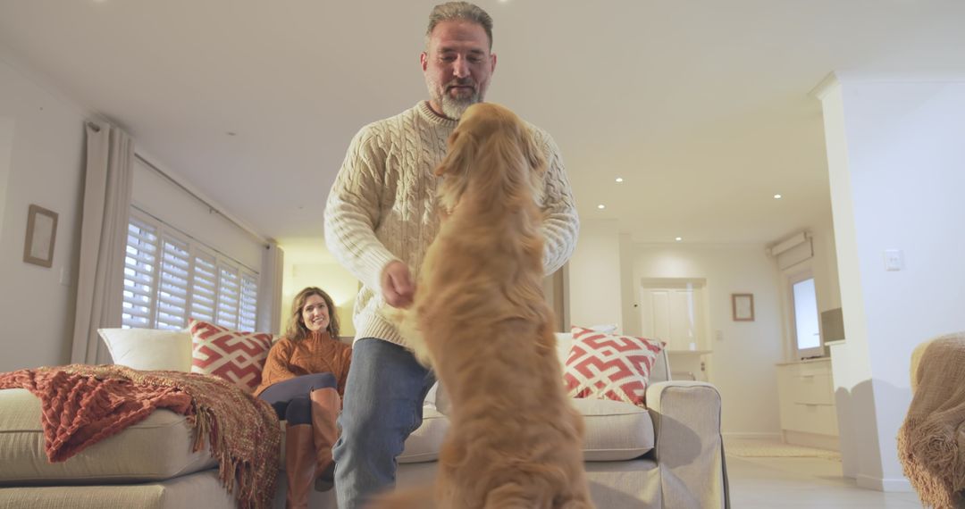 Affectionate Couple Enjoying Playtime with Golden Retriever