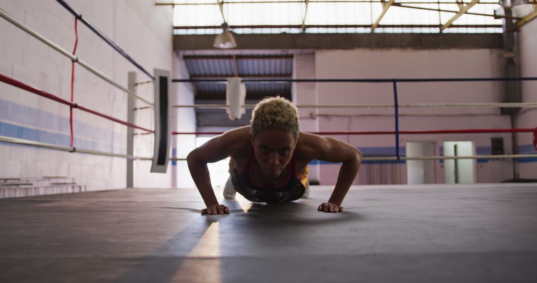 Woman Performing Plank Exercise in Boxing Ring Gym - Free Images, Stock Photos and Pictures on Pikwizard.com