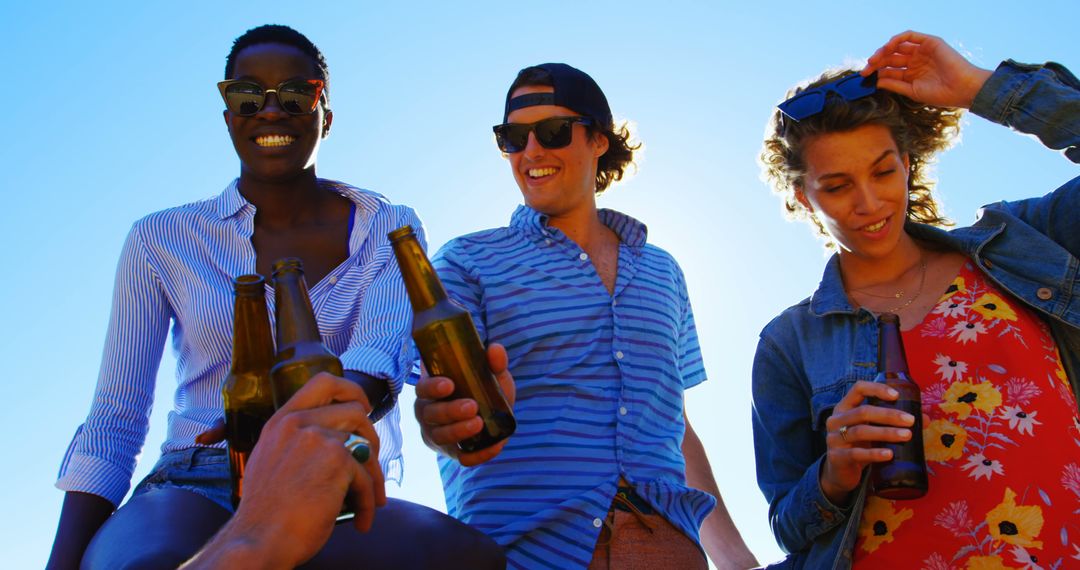 Group of Friends Enjoying Beers at Outdoor Gathering - Free Images, Stock Photos and Pictures on Pikwizard.com