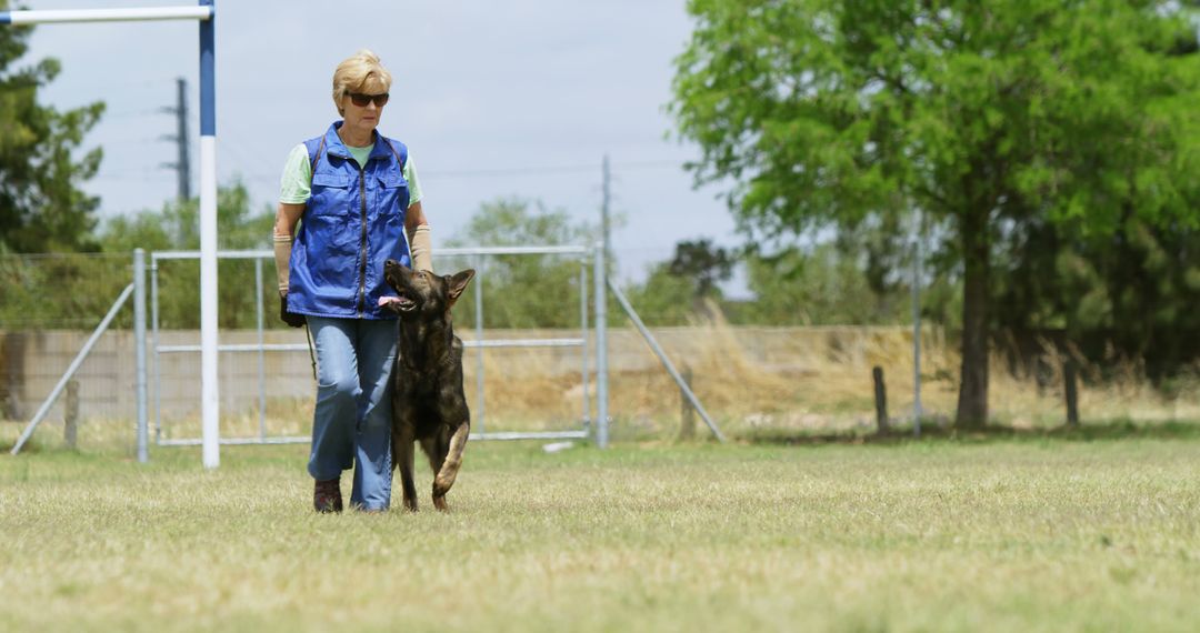 Woman Training German Shepherd Dog in Open Field - Free Images, Stock Photos and Pictures on Pikwizard.com