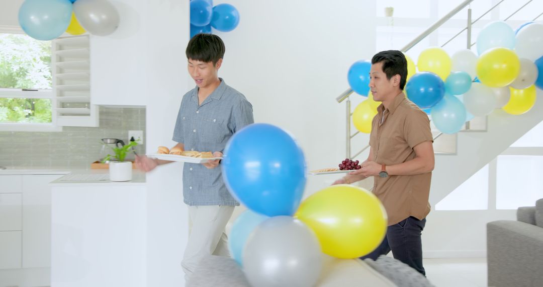 Setting Up Home Party with Colorful Balloons and Snacks