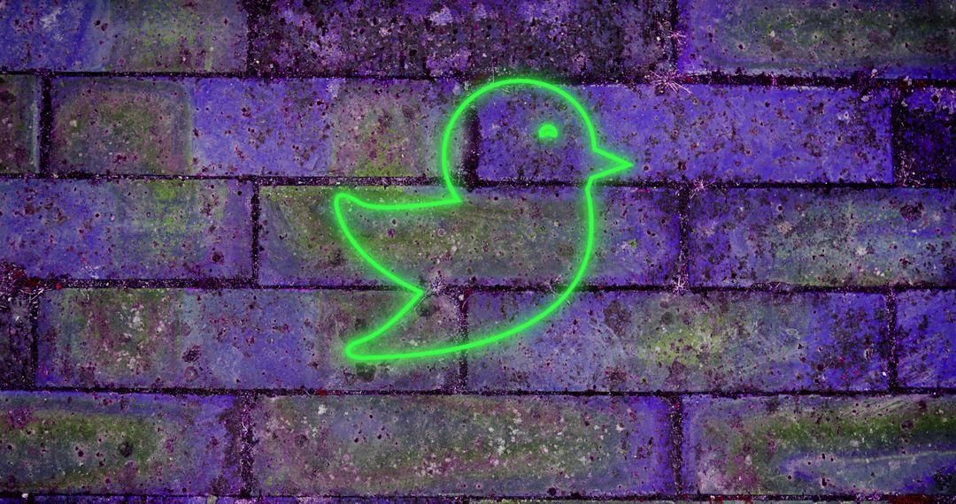 Green Neon Bird on Graffiti Brick Wall Symbolizes Social Media - Free Images, Stock Photos and Pictures on Pikwizard.com