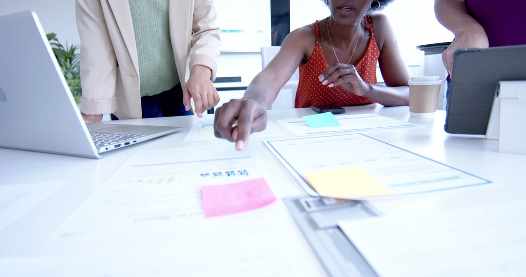 Creative Colleagues Collaborating with Notes and Technology in Office