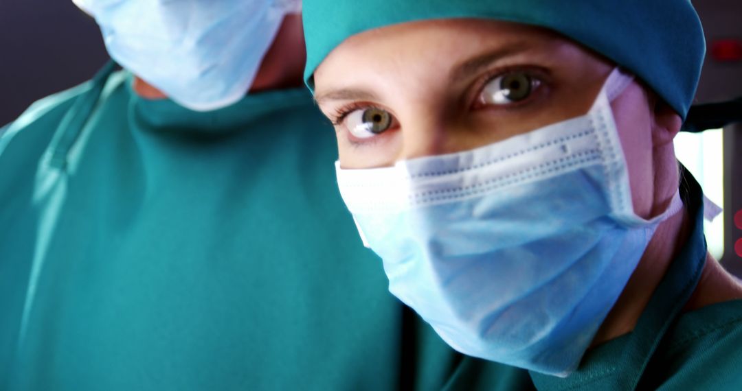 Surgeon and Nurse in Operating Room with Surgical Masks - Free Images, Stock Photos and Pictures on Pikwizard.com