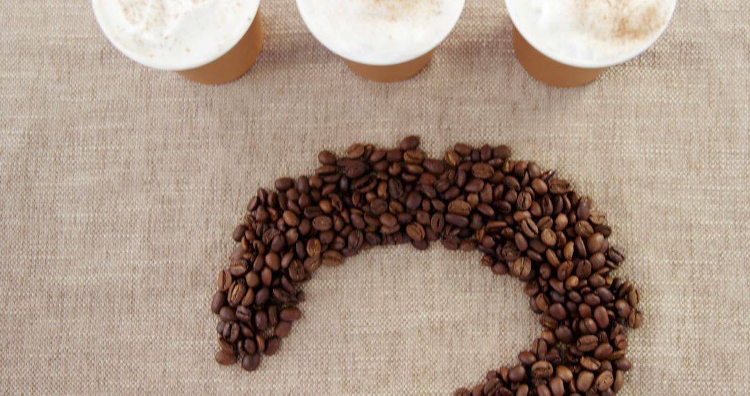 Coffee Cups and Coffee Beans Forming Question Mark on Burlap - Free Images, Stock Photos and Pictures on Pikwizard.com