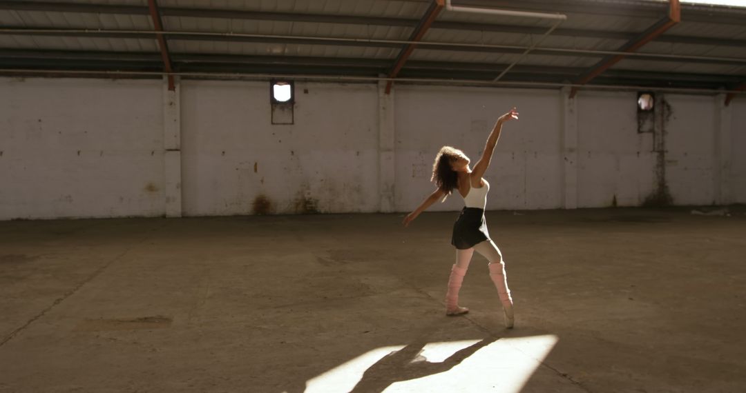 Young Ballet Dancer Practicing in Abandoned Warehouse - Free Images, Stock Photos and Pictures on Pikwizard.com