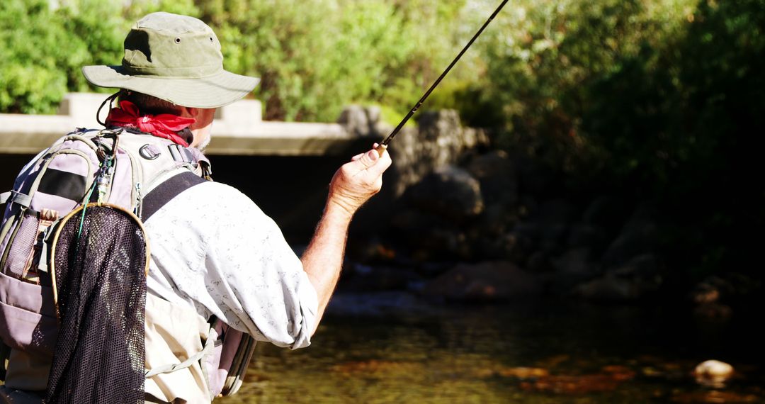 Angler Fly Fishing In River Amidst Lush Greenery - Free Images, Stock Photos and Pictures on Pikwizard.com