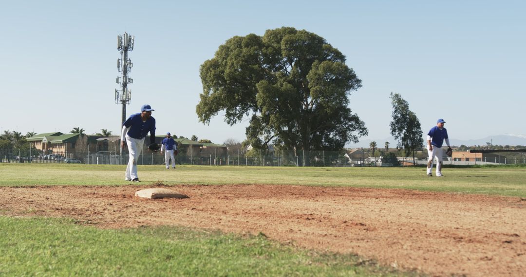 Diverse Baseball Team on Field Practicing Pitches