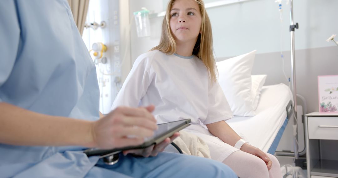 Female Patient Listening to Doctor in Hospital Room - Free Images, Stock Photos and Pictures on Pikwizard.com