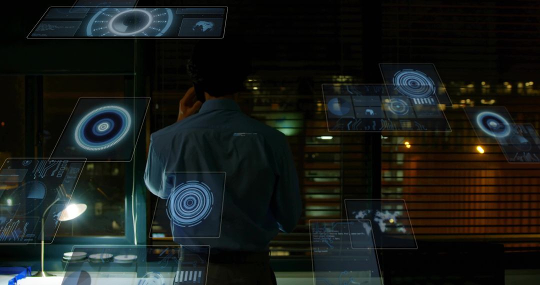 Businessman monitoring holographic data dashboards in late-night office using smartphone
