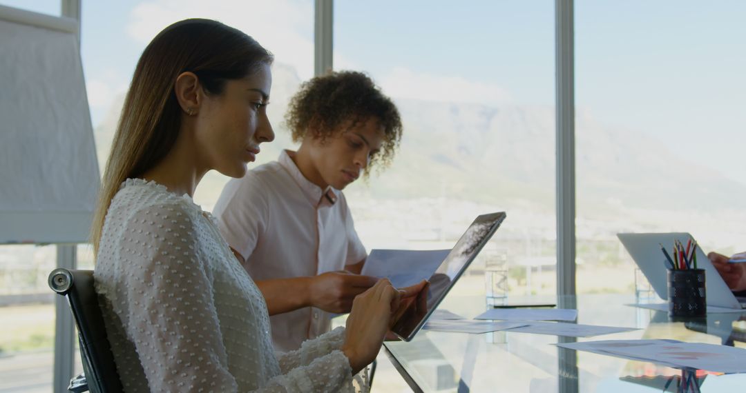 Diverse Business Executives Collaborating in Modern Conference Room