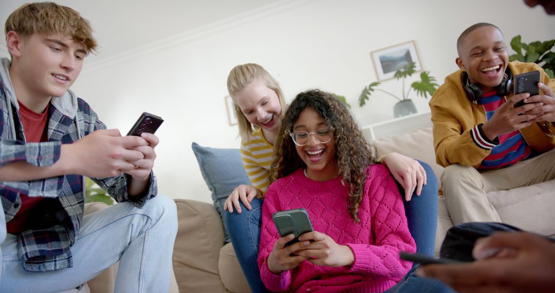 Diverse Group of Friends Enjoys Using Smartphones Together - Free Images, Stock Photos and Pictures on Pikwizard.com