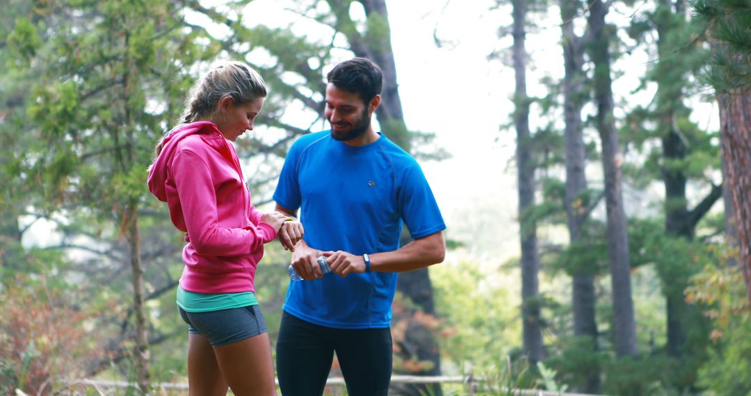 Man and Woman Discussing Workout in Forest - Free Images, Stock Photos and Pictures on Pikwizard.com