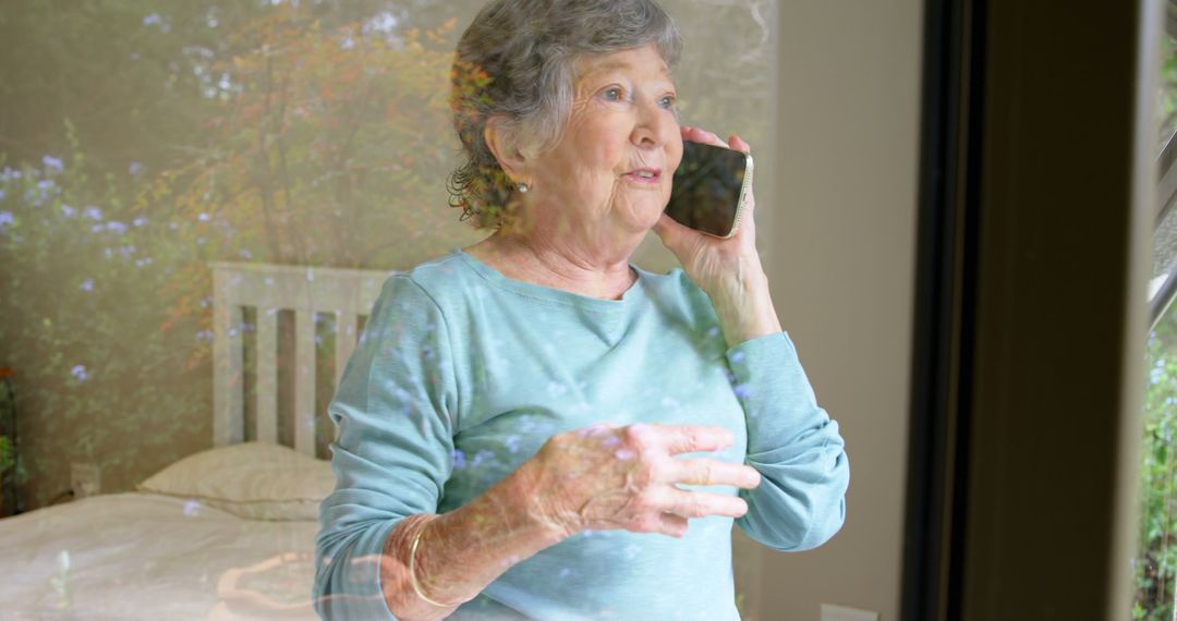 Elderly Woman Talking on Smartphone Through Window - Free Images, Stock Photos and Pictures on Pikwizard.com