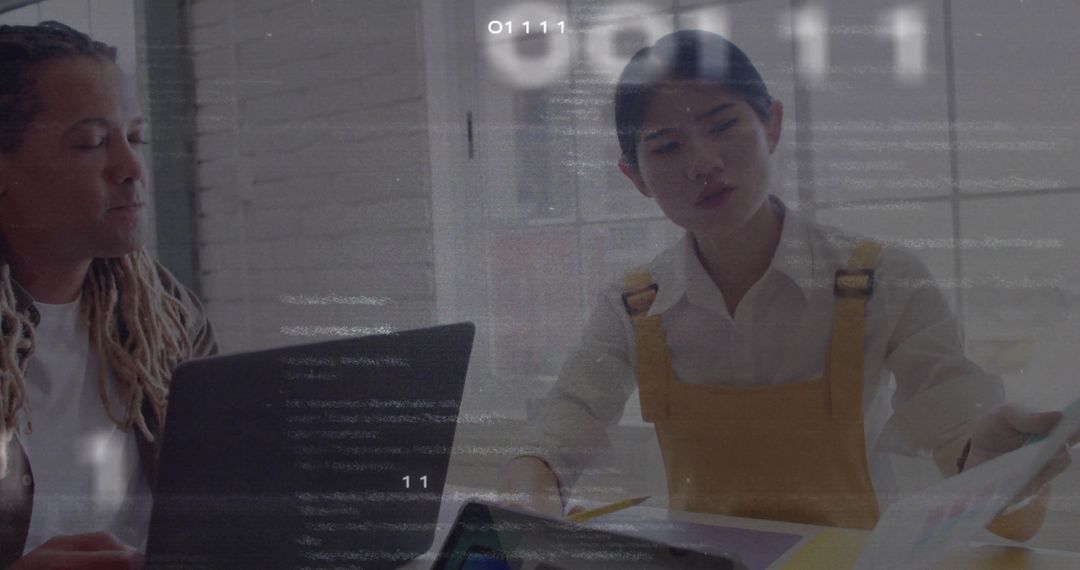 Professional Team Collaborating on Technological Project in Modern Office