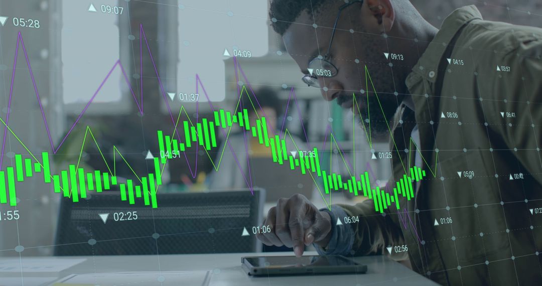 Man Analyzing Data on Tablet with Financial Graph Overlay - Free Images, Stock Photos and Pictures on Pikwizard.com