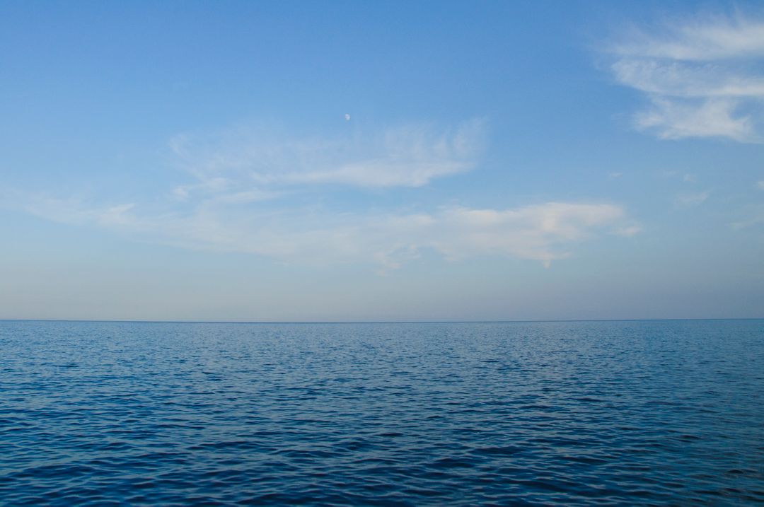 Calm Ocean with Clear Blue Sky - Free Images, Stock Photos and Pictures on Pikwizard.com
