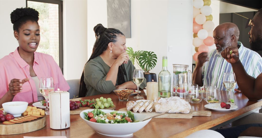 Family Enjoying Retirement Celebration with Lively Conversation at Dining Table