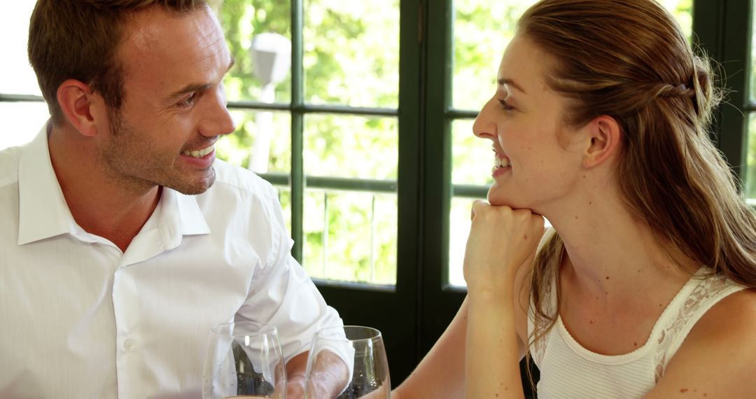 Smiling Couple Enjoying Romantic Dinner - Free Images, Stock Photos and Pictures on Pikwizard.com