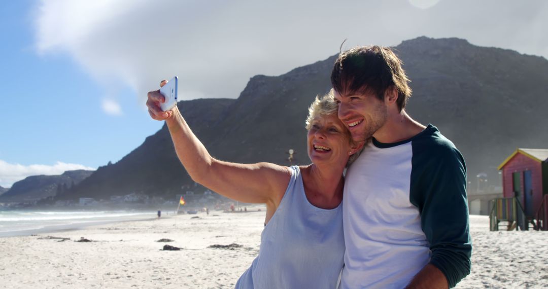 Mother and Son Taking Selfie on Beach - Free Images, Stock Photos and Pictures on Pikwizard.com