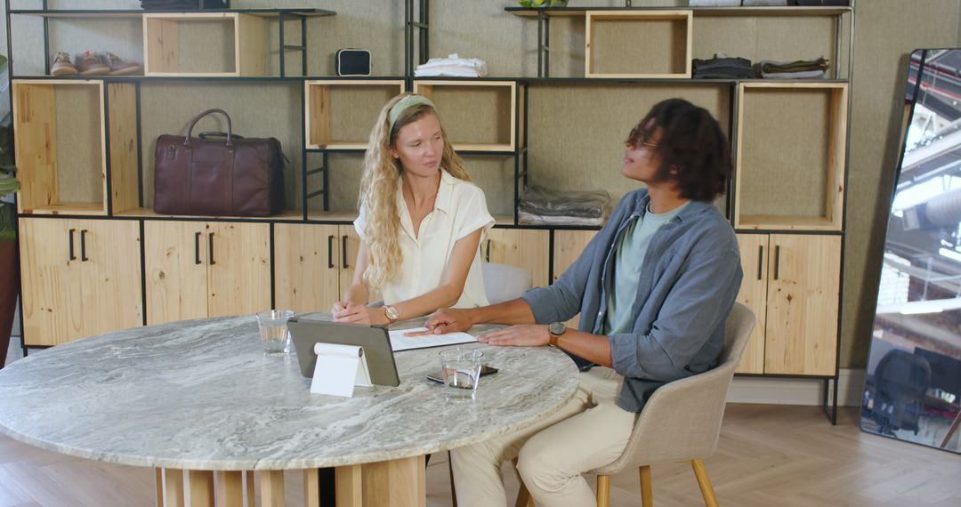Diverse Colleagues Collaborate Around Office Table Discuss Project
