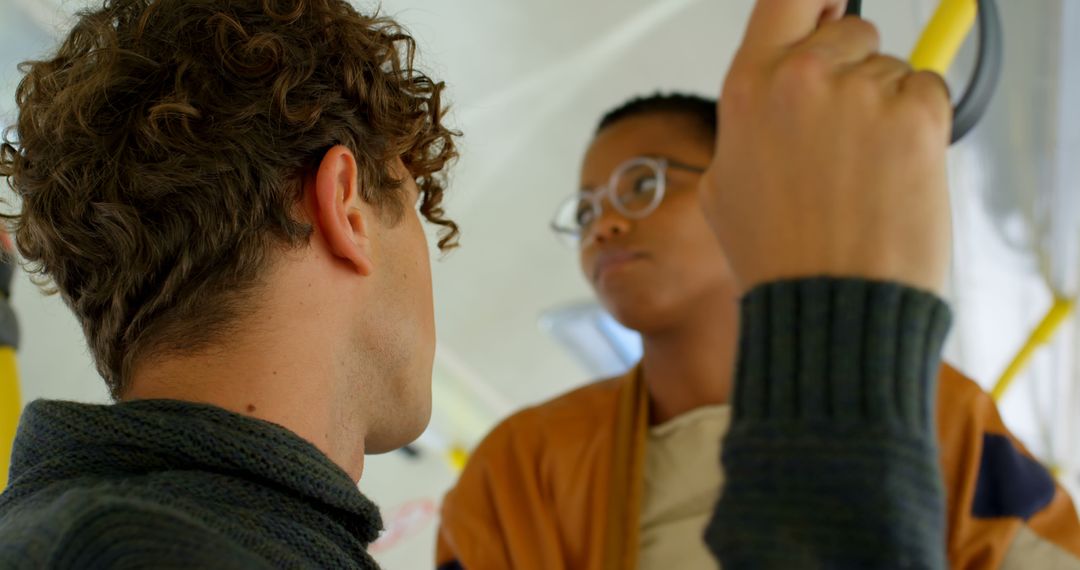 Young People Engaging in Conversation on Public Transit - Free Images, Stock Photos and Pictures on Pikwizard.com