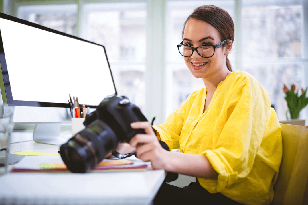 Young Woman Photographer with Digital Camera and Transparent Monitor