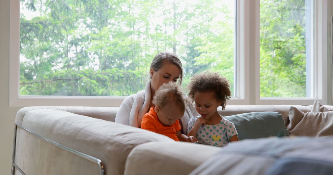 Caring Mother with Mixed Children Relaxing at Home