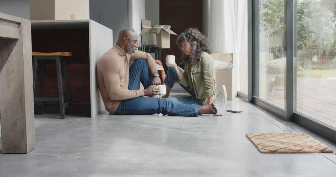 Couple Enjoys Coffee on Floor During New House Move