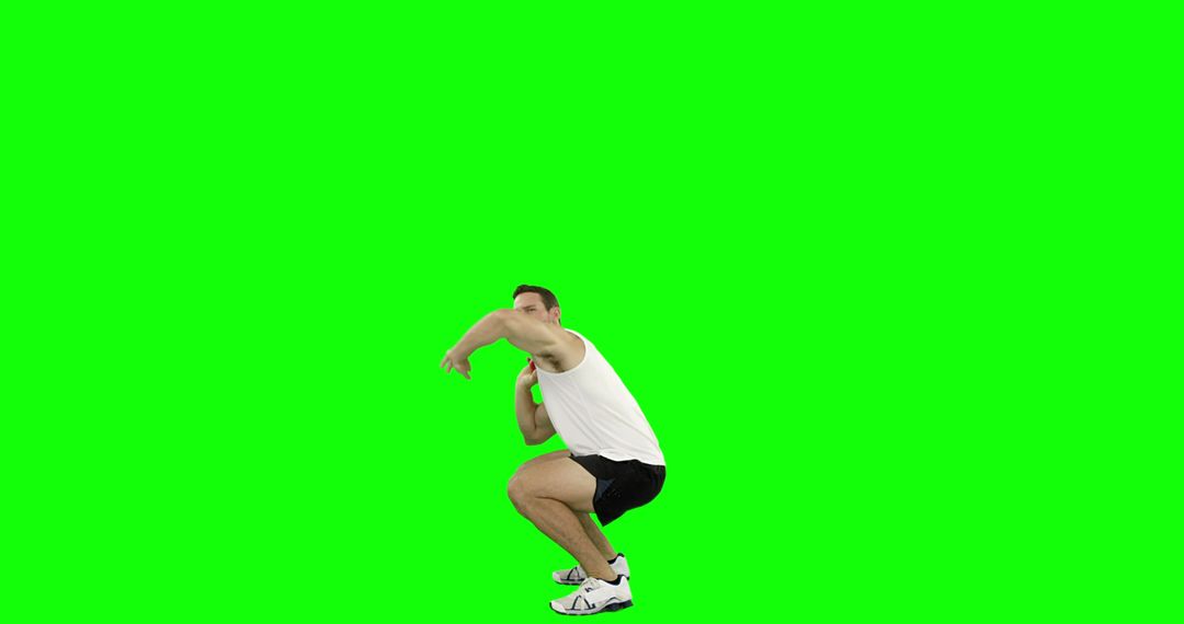 Man Performing Squats in Front of Green Screen Background - Free Images, Stock Photos and Pictures on Pikwizard.com