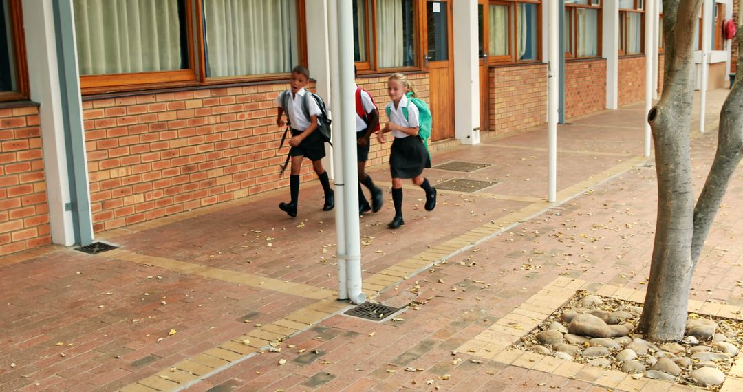 Young Schoolchildren Walking Outside Classroom Building - Free Images, Stock Photos and Pictures on Pikwizard.com