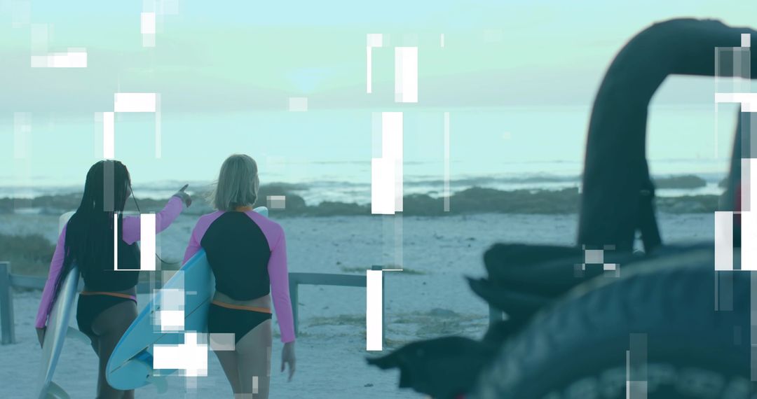 Surfers in Pink Rash Guards Walking Towards Ocean